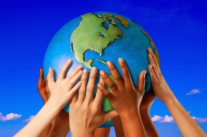 Hands on a globe --- Image by © Royalty-Free/Corbis